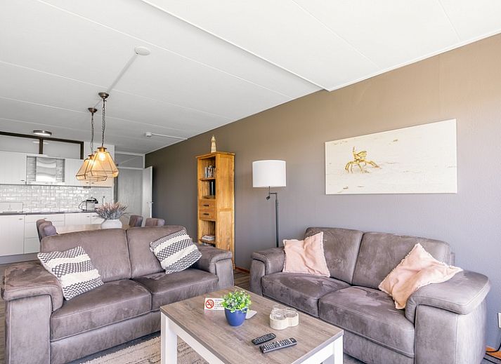 Living room of Apartment Juliana 094 Island and Sea View in De Koog, Texel with sea view and comfortable seating area.