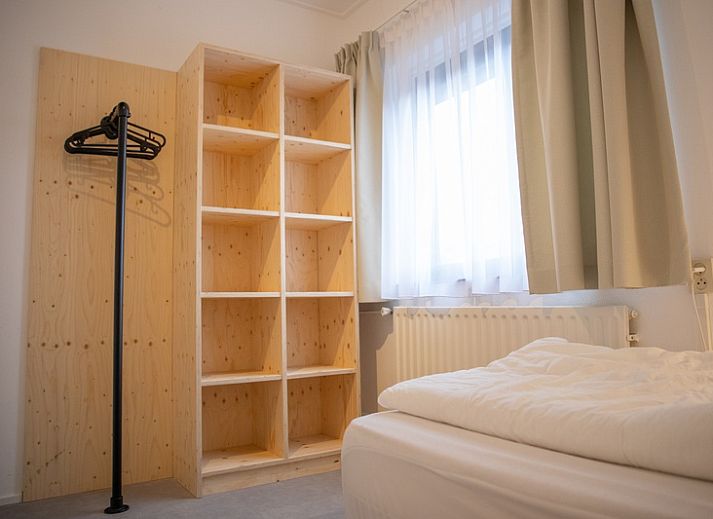 Gemuetliches Wohnzimmer im Appartement 4 Personen, De Koog, Texel, mit moderner Einrichtung und bequemer Sitzecke.