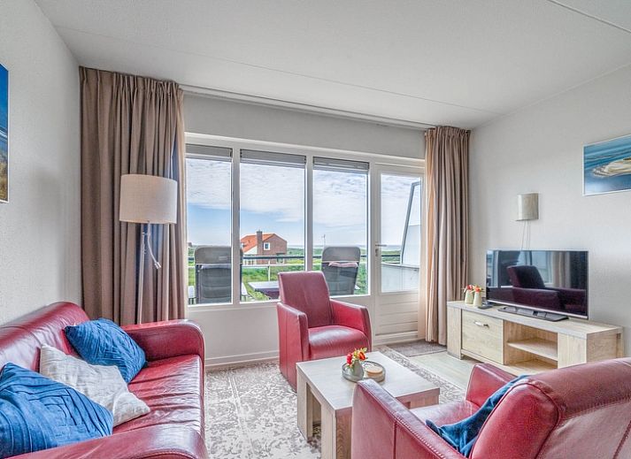 Gezellige woonkamer van Appartement Juliana 138 Eiland en Zeezicht in De Koog, Texel met uitzicht op de Waddeneilanden.