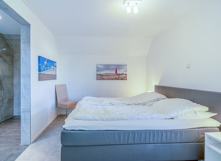 Gezellige tuin bij Vakantiehuis Kamperfoelie 93 in De Koog, Texel, perfect voor een ontspannen verblijf op de Waddeneilanden.