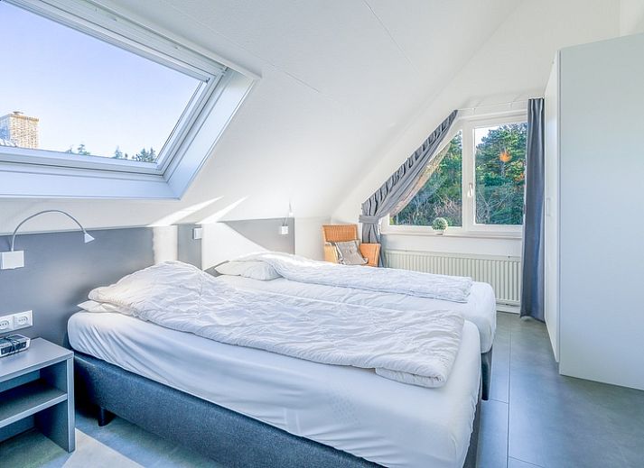 Gezellige tuin bij Vakantiehuis Kamperfoelie 93 in De Koog, Texel, perfect voor een ontspannen verblijf op de Waddeneilanden.