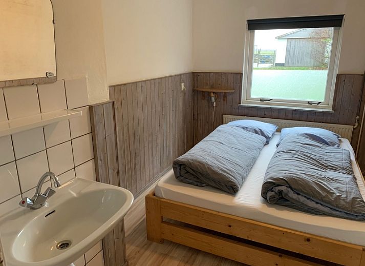 Vakantiehuis 0386 in De Koog Texel met groene tuin en terras voor een ontspannen verblijf op de Waddeneilanden.