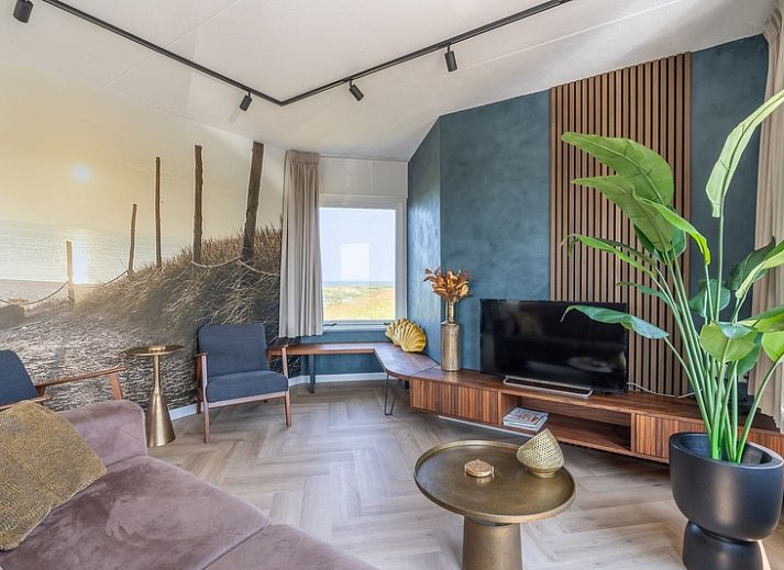 Stylish living room in Apartment Juliana 120 Eilandzicht, De Koog, Texel with modern interior and large windows.