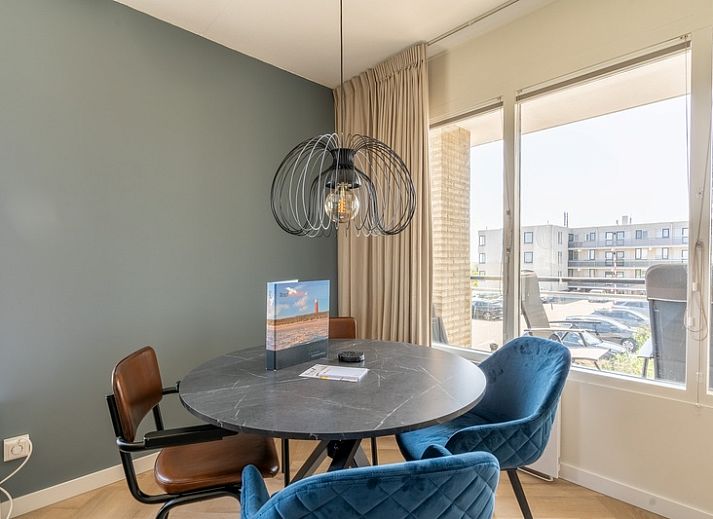 Cozy sitting area in Apartment Juliana 120 Eilandzicht, De Koog, Texel with a view of nature.