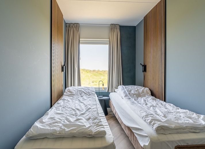 Cozy sitting area in Apartment Juliana 120 Eilandzicht, De Koog, Texel with a view of nature.