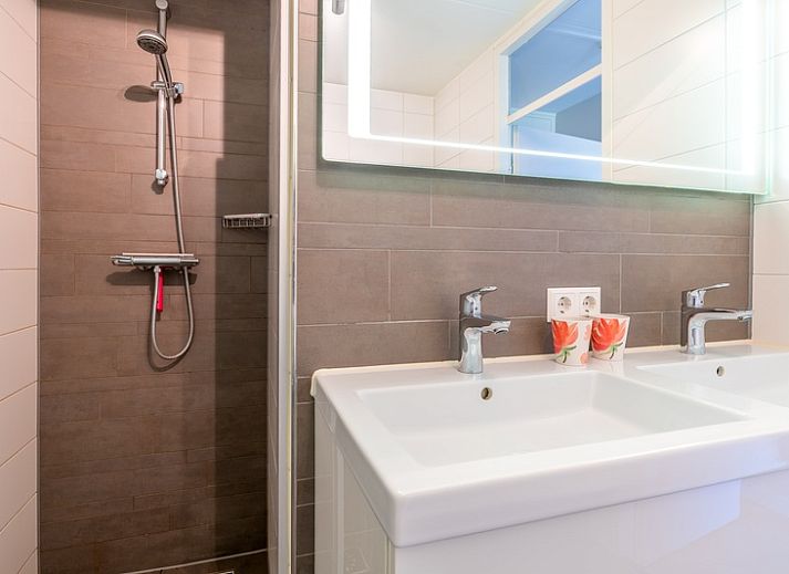 Cozy sitting area in Apartment Juliana 120 Eilandzicht, De Koog, Texel with a view of nature.