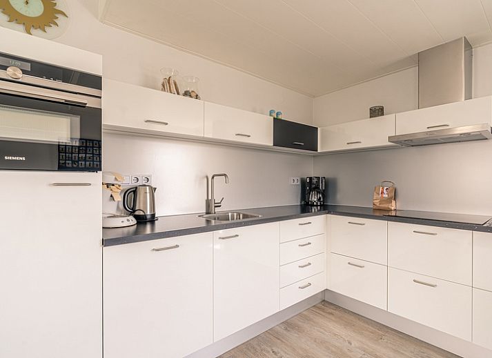 Modern furnished living room of Apartment Juliana 132 Eilandzicht in De Koog, Texel overlooking the dunes.