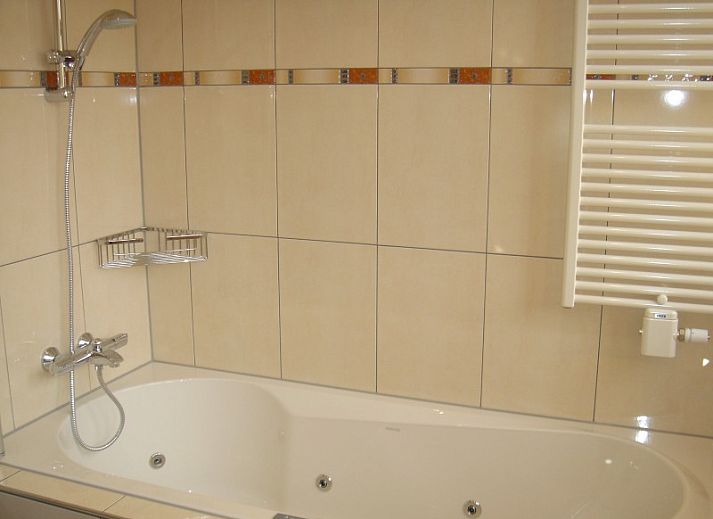 Comfortabele woonkamer in 6-pers. Vakantiehuis met Sauna in De Koog, Texel, Waddeneilanden.