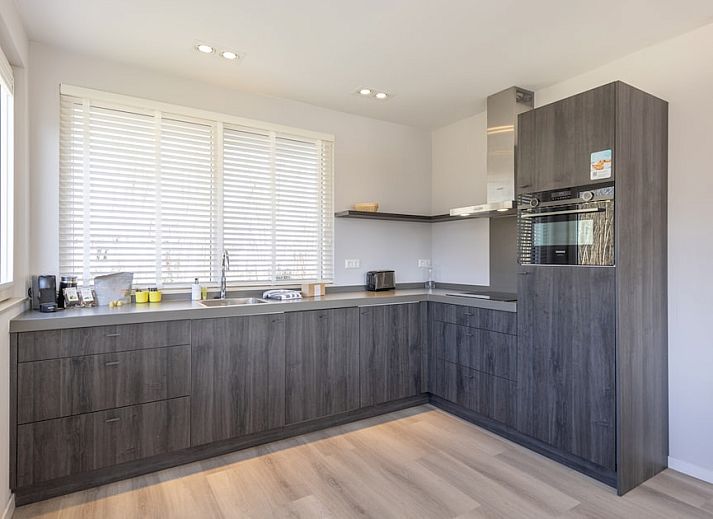 Villa 8, ein luxurioeses Ferienhaus in De Koog, Texel, mit grossem Garten und Terrasse, ideal fuer einen entspannten Aufenthalt auf den Watteninseln.