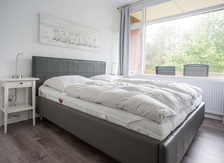 Stilvolles Wohnzimmer in 't Kerckeland - Appartement Kerckeland 92 in De Koog, Texel, mit komfortabler Sitzecke und moderner Moeblierung.