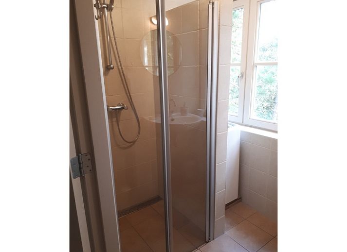 Gezellige woonkamer van Pauwenhof Texel in De Koog met comfortabele zitplaatsen.