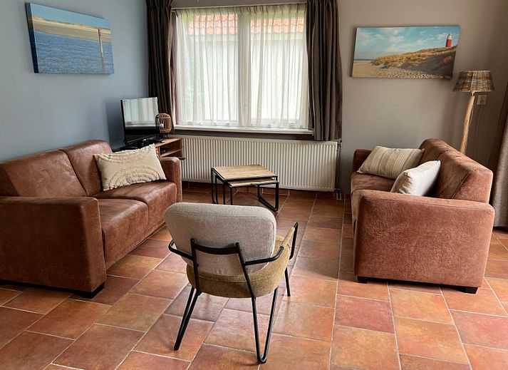 Landgoed Springtij - Koetshuis 3 in De Koog, Texel met charmante buitenkant en groene omgeving.