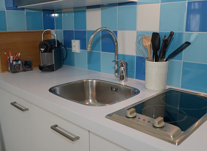 Cozy living room in Grand Hotel Opduin - Holiday home A, De Koog, Texel, with modern decor and large window.