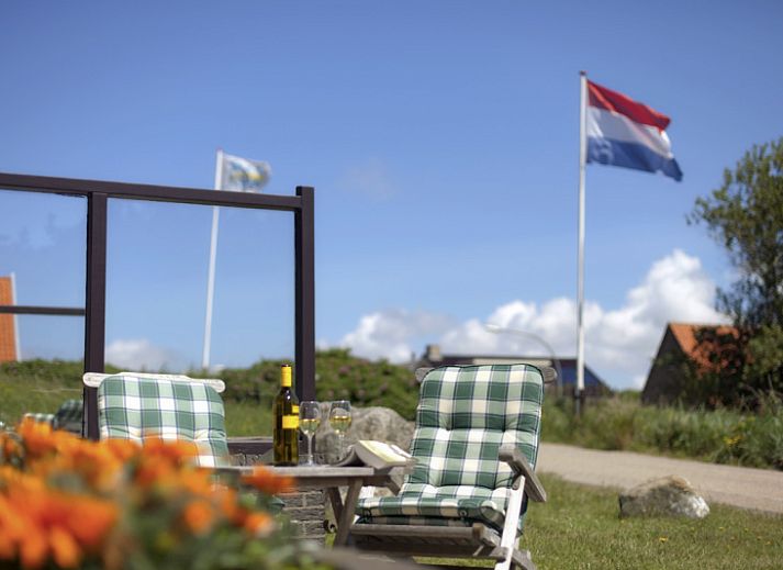 Exterior of Grand Hotel Opduin - Holiday Apartment A in De Koog, Texel, surrounded by natural beauty and bicycle paths.