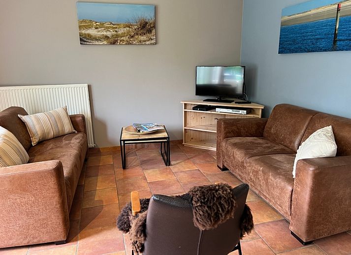 Landgoed Springtij - Koetshuis 2 in De Koog, Texel met charmante buitenkant en groene omgeving.