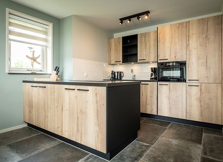 Landhuis vakantiewoning in De Koog, Texel met zonnig terras en comfortabele buitenruimte.