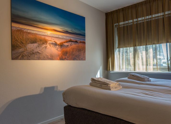 Zilte Bries vakantiewoning in De Koog, Texel, met een uitnodigend pad naar het terras.