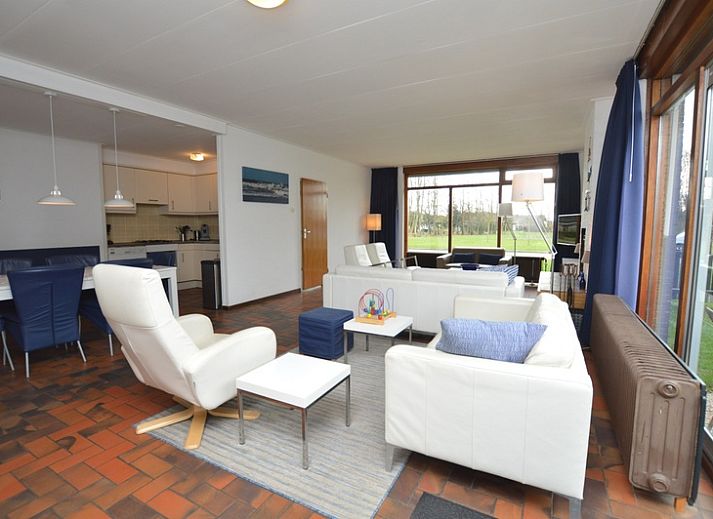 Cozy living room in Orchismient 18 large, De Koog, Texel with modern furnishings and fireplace.