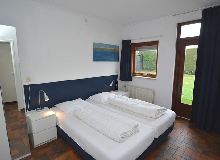 Comfortable sitting area in Orchismient 18 large vacation home, De Koog, Texel overlooking the garden.