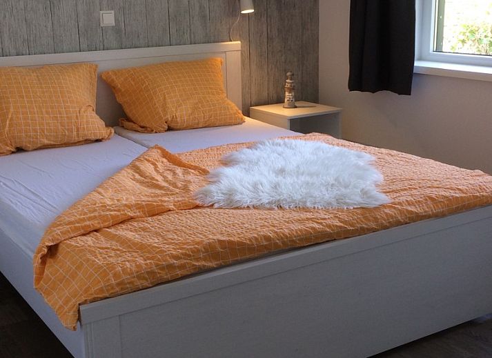 Terrace of Park Verste Coogh vacation home in De Koog, Texel with modern garden table.