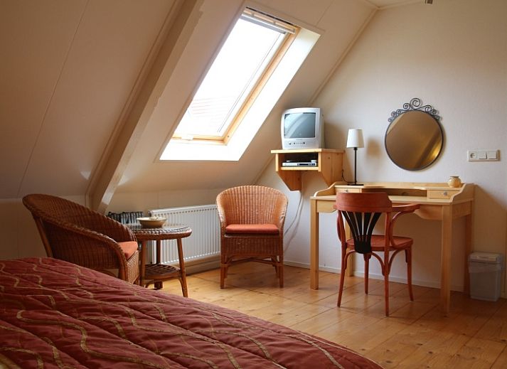 Gemuetliches Wohnzimmer mit offener Kueche im Appartement Moleneind, De Waal, Texel.