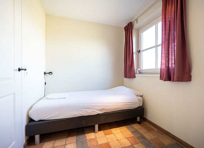 Cozy living room in Cottage in De Waal, Texel with lots of light and access to terrace.