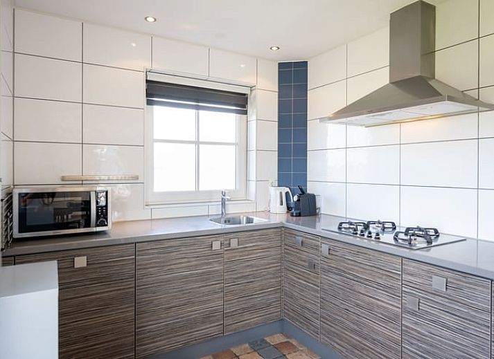 Modern bathroom with bathtub in vacation home Huisje in De Waal, Texel on the Wadden Islands.