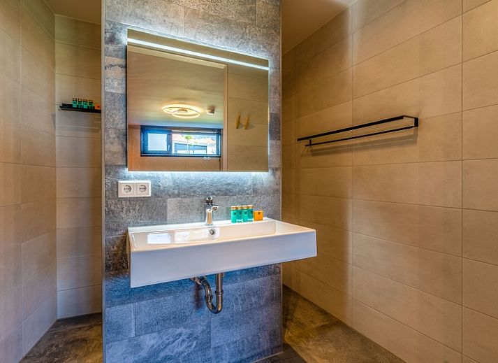 Stijlvolle zithoek in Villa 16 Weegeswaal, De Waal, Texel, perfect voor ontspanning.