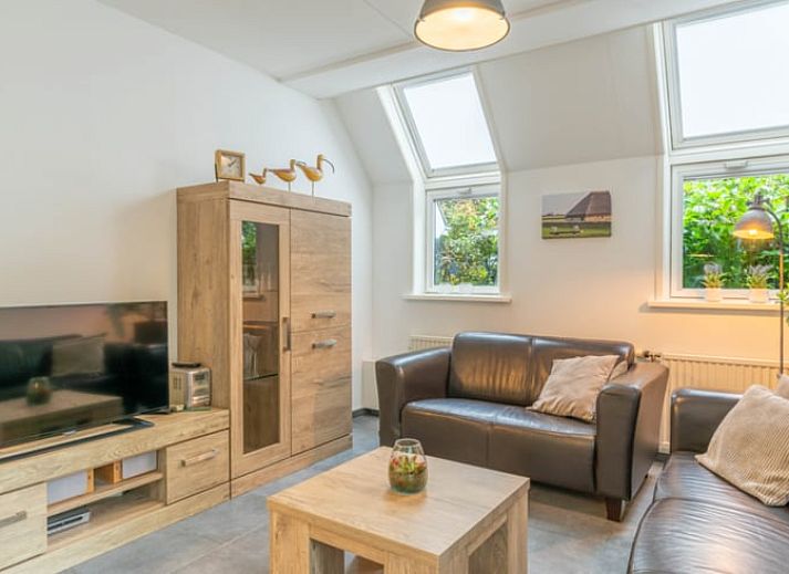 Huisje in De Waal, Texel met speeltuin en groene omgeving, ideale vakantieaccommodatie op de Waddeneilanden.