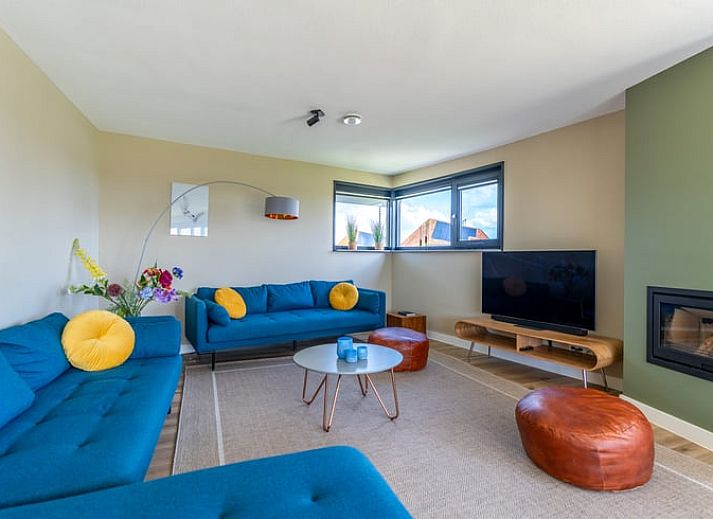 Vakantiehuisje in De Waal, Texel met prachtig uitzicht op het platteland bij zonsondergang.