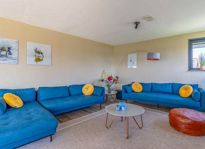 Vakantiehuisje in De Waal, Texel met prachtig uitzicht op het platteland bij zonsondergang.