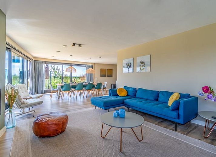 Vakantiehuisje in De Waal, Texel met prachtig uitzicht op het platteland bij zonsondergang.