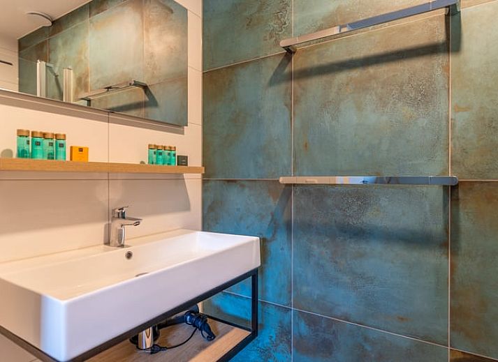 Comfortabele zithoek in Vakantiehuisje in De Waal, Texel, ideaal voor ontspanning.