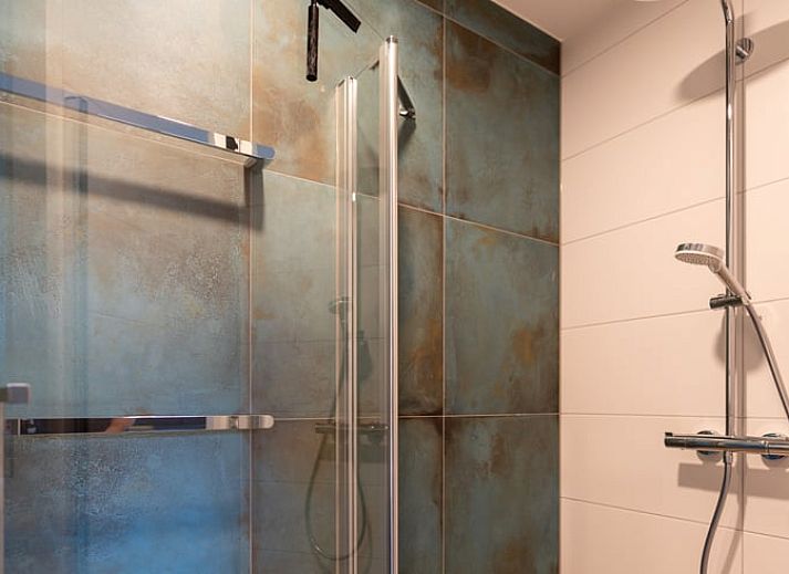 Comfortabele zithoek in Vakantiehuisje in De Waal, Texel, ideaal voor ontspanning.