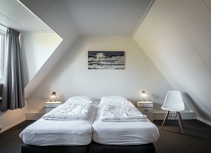 Cozy living space in Holiday Home De Heggemus, Den Burg, Texel with modern kitchen.