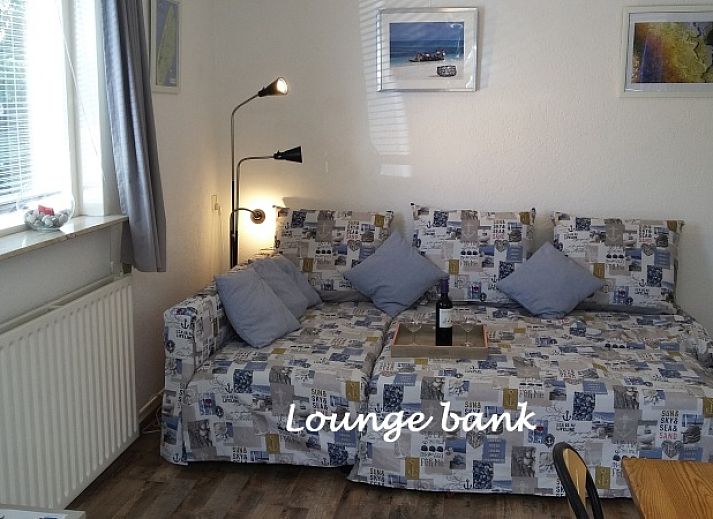 Sfeervolle slaapkamer in vakantiehuis Gastvrij, Den Burg, Texel. Ideaal voor een ontspannen verblijf op de Waddeneilanden.