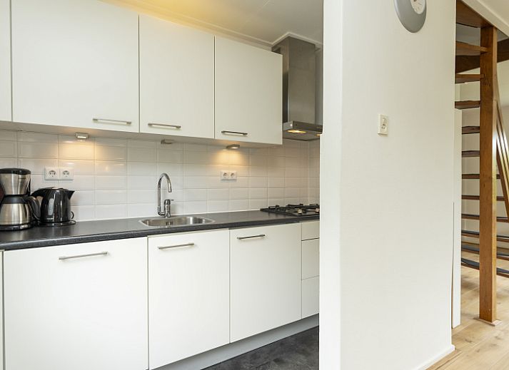 Gemuetliches Wohnzimmer von De Wending in Den Burg, Texel mit komfortabler Sitzecke.