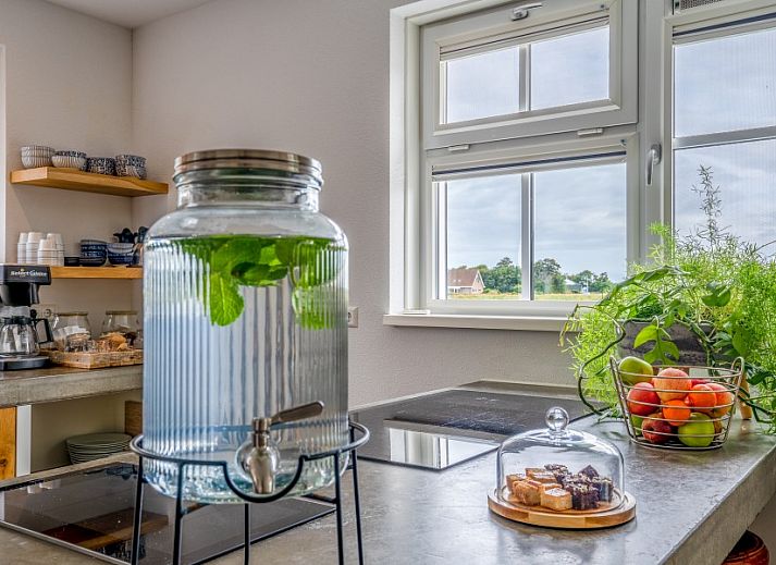 Aerial photo of Group Residence Nieuw Leven Texel in Den Burg with green surroundings and playground on the Wadden Islands.
