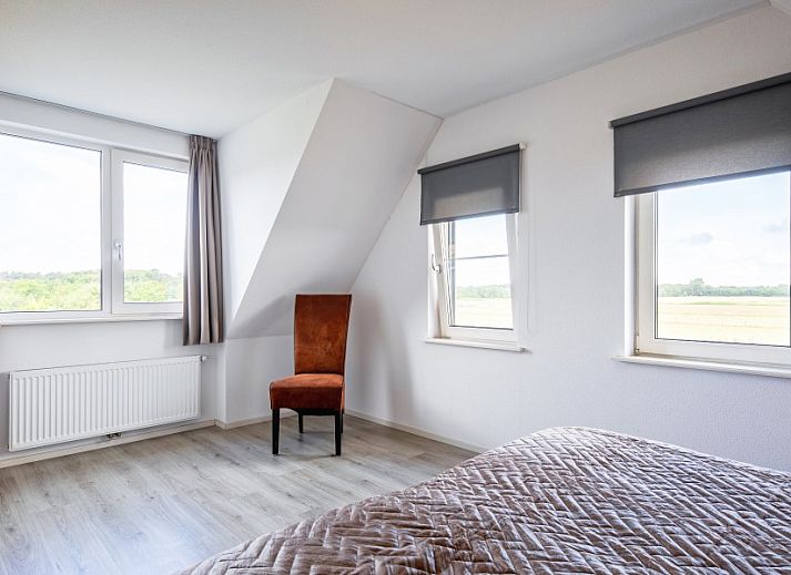 Veranda of Wulpenweid 12 A Lammetje, vacation home in De Dennen, Texel overlooking nature.