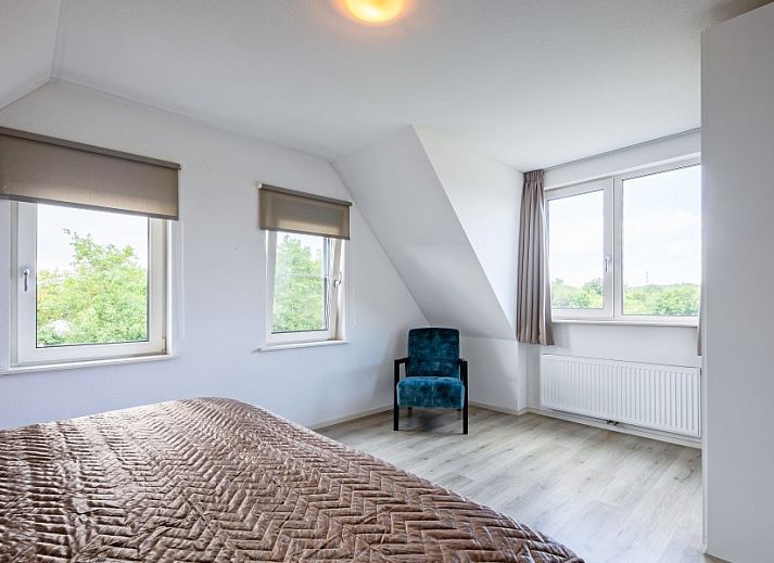 Veranda of Wulpenweid 12 A Lammetje, vacation home in De Dennen, Texel overlooking nature.