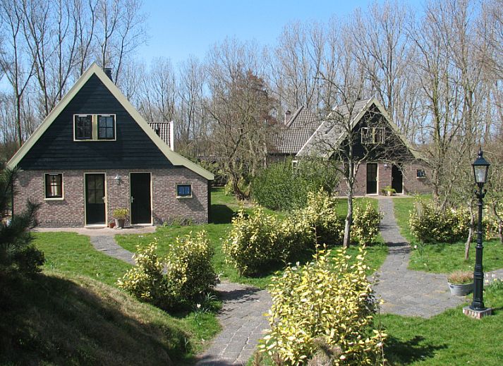 Gezellige woonkamer van Woeste Hoeve vakantiehuis in Den Burg, Texel met comfortabele banken