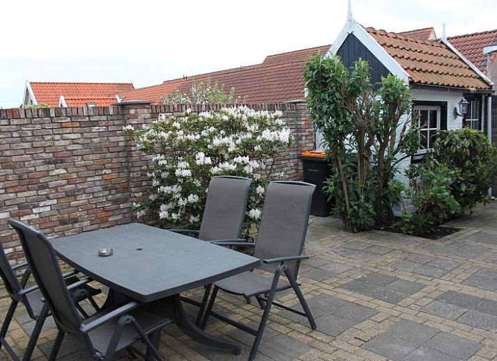 Cozy living room in vacation home De Molen, Den Burg, Texel with comfortable seating area.