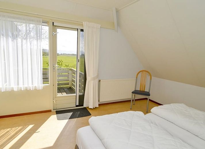 Vakantiehuis in Den Burg entree met groene omgeving op Texel