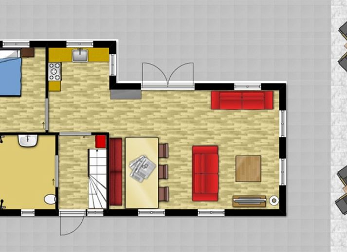 Cozy living room in vacation home Sonja, Texel with comfortable red sofa.