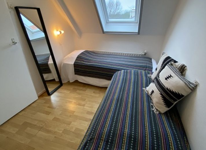 Gemuetliches Wohnzimmer in Klif 1 Wohnung 1, Den Hoorn Texel, mit Kunst an der Wand, Ferienhaus.