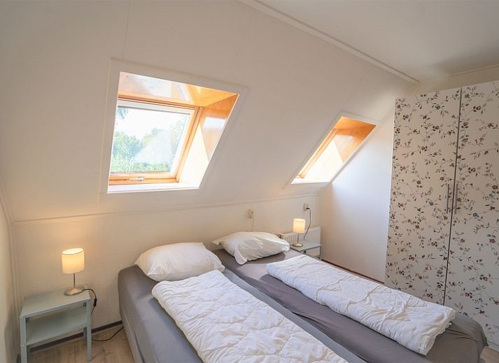 Gezellige woonkamer van Eendenkooi vakantiehuis in Den Hoorn Texel met comfortabele zitruimte.