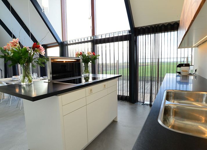 Gezellige houtkachel in De Waddenhof, vakantiehuis Den Hoorn, Texel, Waddeneilanden.