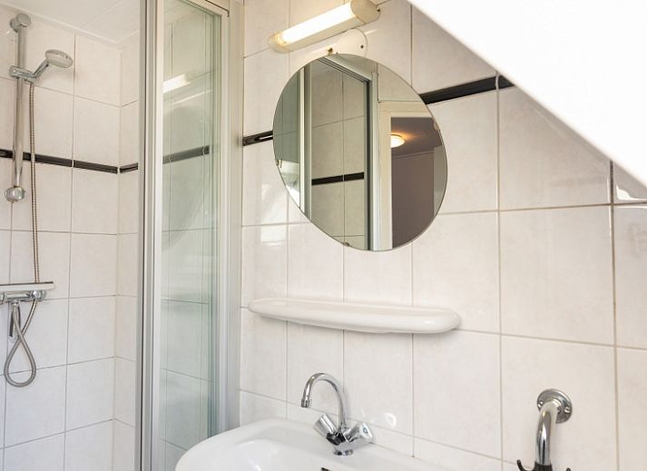 Comfortabele woonkamer in Duiventil vakantiehuis Den Hoorn Texel met moderne inrichting.