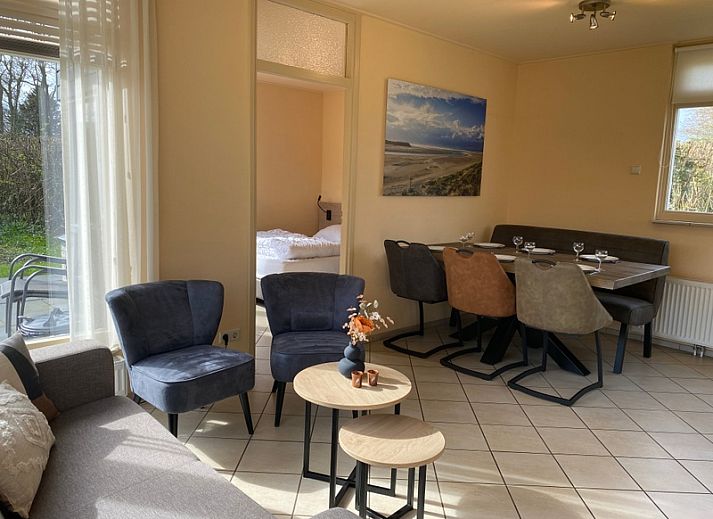 Vacation home Noordzee in Oosterend, Texel with spacious terrace and green garden, ideal for relaxation.