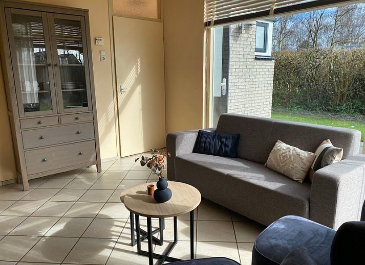 Vacation home Noordzee in Oosterend, Texel with spacious terrace and green garden, ideal for relaxation.